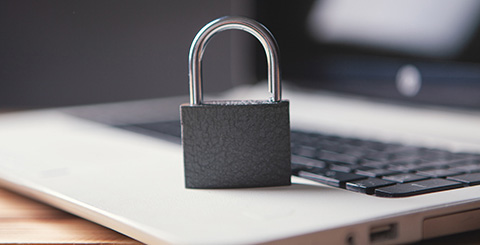 Padlock on a laptop representing protected business data